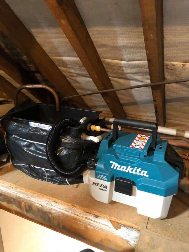 RSD Heating cleaning an central heating expansion tank in a loft