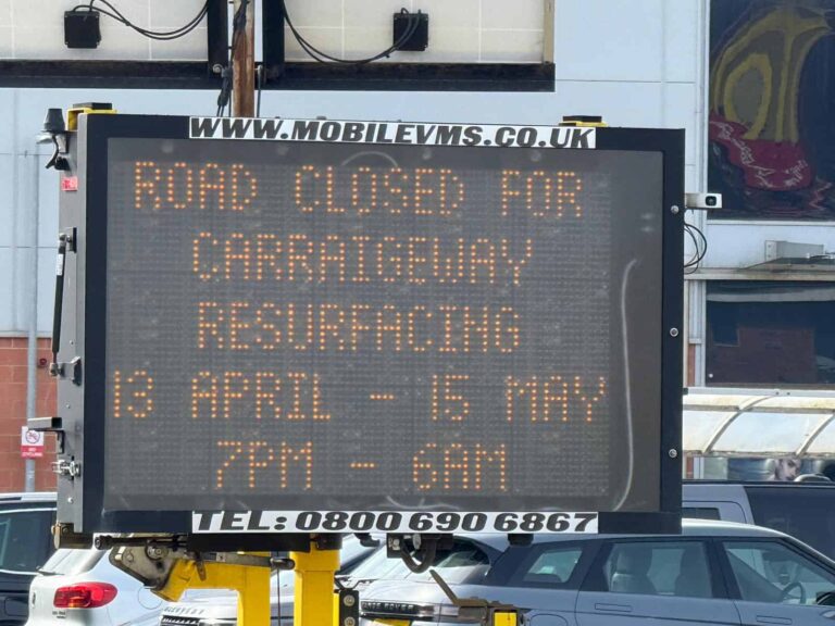 Road closure sign on A259 Bexhill Road showing incorrect 6am reopening time