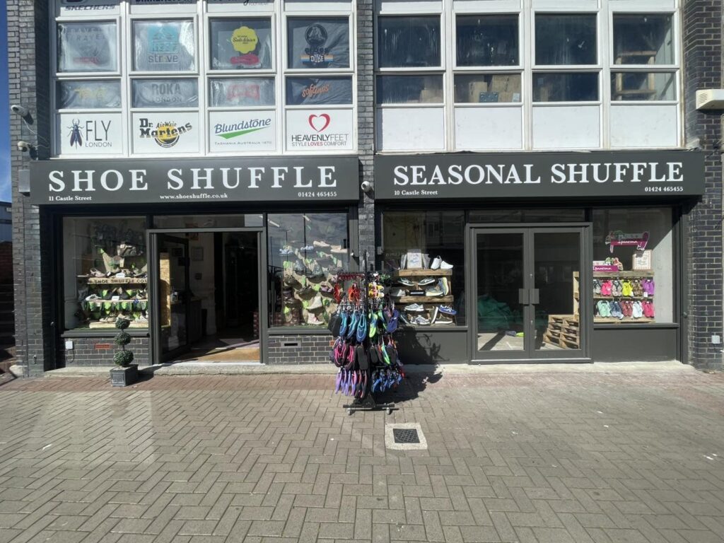 Shoe Shuffle shop front on Castle Street in Hastings with neighbouring unit being taken over
