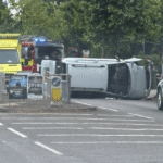 Overturned vehicle on Sedlescombe Road North in Hastings with police, ambulance and fire crews at the scene.
