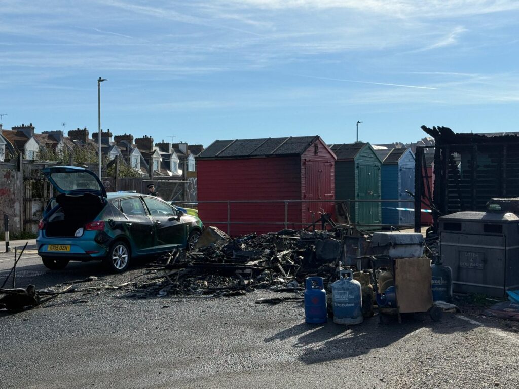 Burnt caravan, damaged car and partially destroyed beach hut at Cinque Ports Way in St Leonards-on-Sea following an early morning fire.